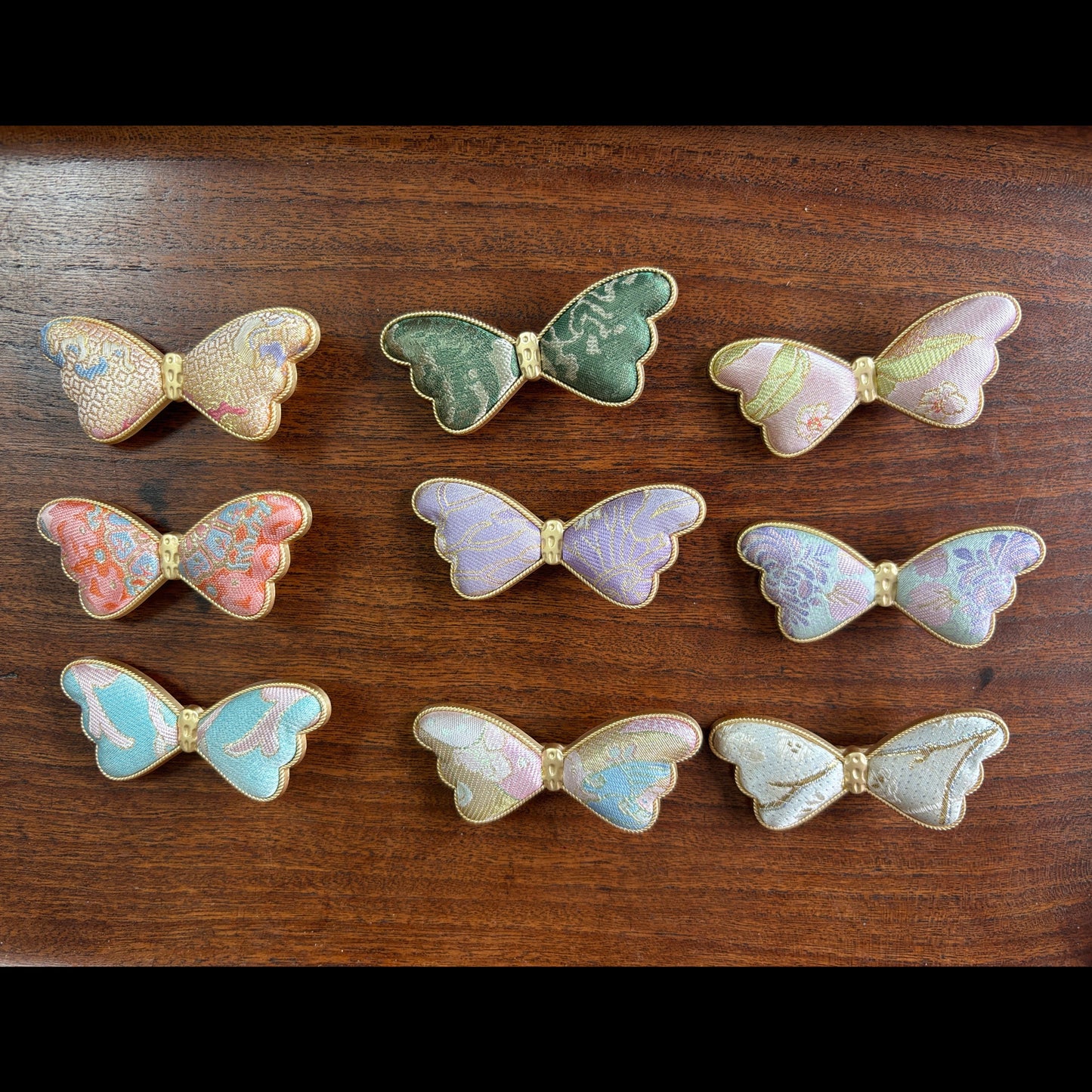 JOFAE Kyoto handmade brocade butterfly hair clip featuring intricate floral patterns and delicate craftsmanship.