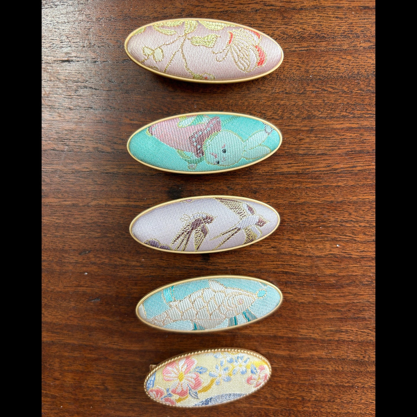 JOFAE Kyoto handmade brocade oval clip with intricate pattern, showcasing quiet luxury style in elegant fabric and craftsmanship.