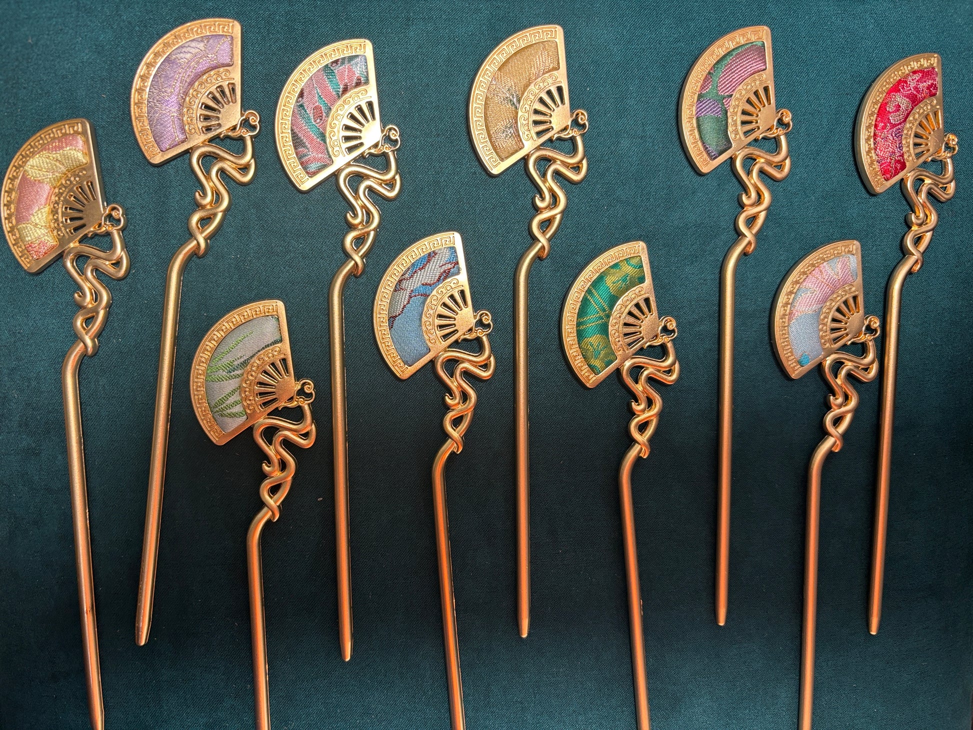 JOFAE Kyoto handmade folding fan hair stick featuring intricate design, symbolizing prosperity and grace, with wooden and fabric elements.